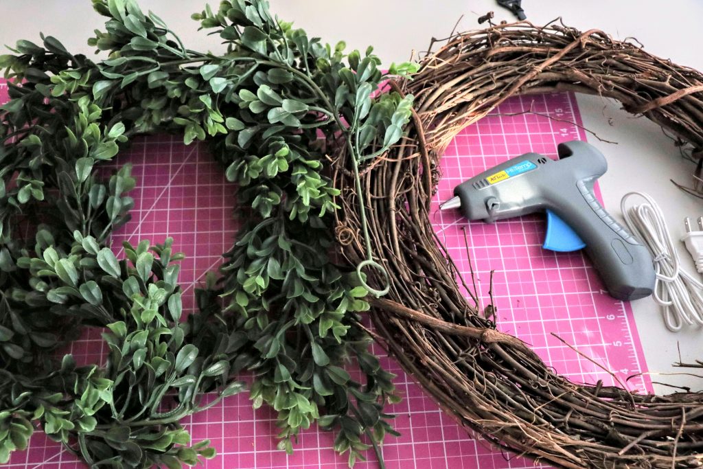 Here is our tutorial for how to make a boxwood wreath for under $20.